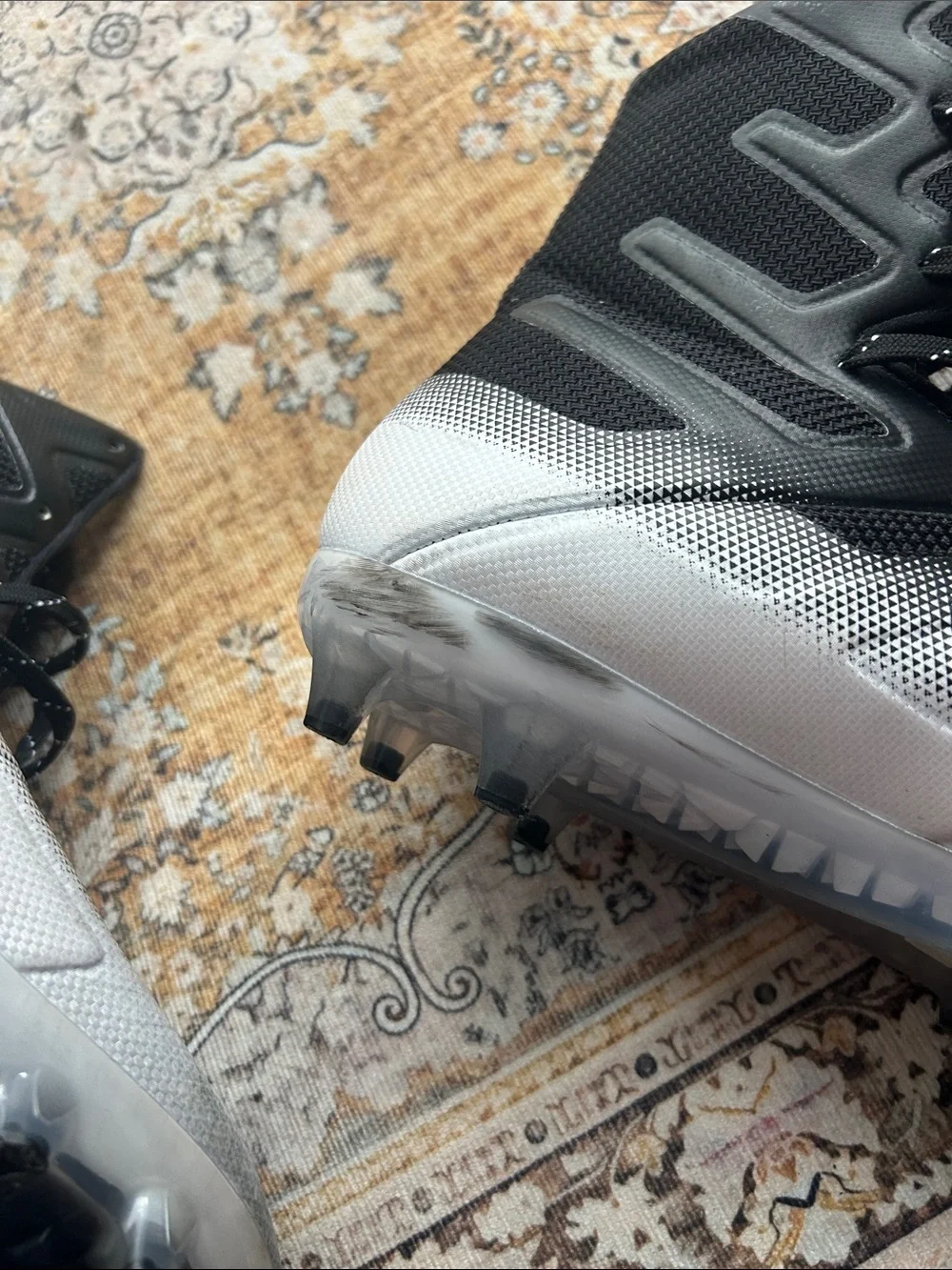 Under Armour Black and Silver High-Top Athletic cleats